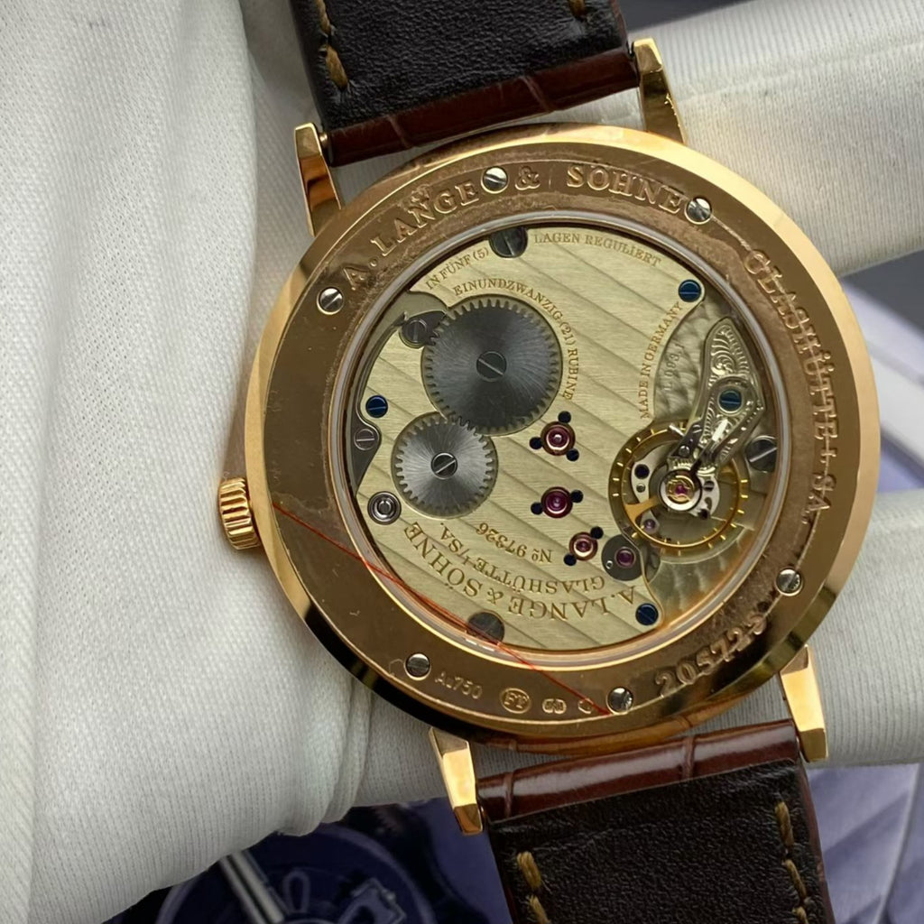 A. Lange & Söhne Saxonia Ref. 211.032 with box no warranty card unworn stock protective film intact 40mm dial rose gold hand wound mechanical