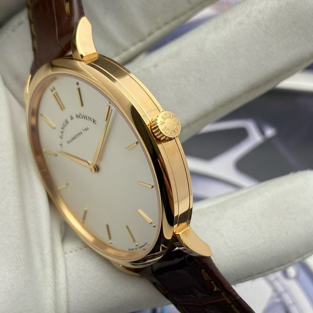 A. Lange & Söhne Saxonia Ref. 211.032 with box no warranty card unworn stock protective film intact 40mm dial rose gold hand wound mechanical